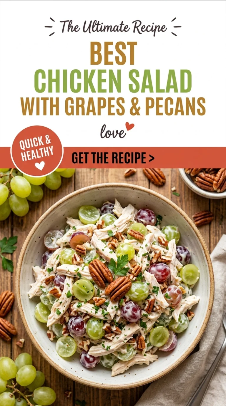 Creamy chicken salad with halved red grapes and toasted pecans in a white bowl, garnished with fresh parsley.